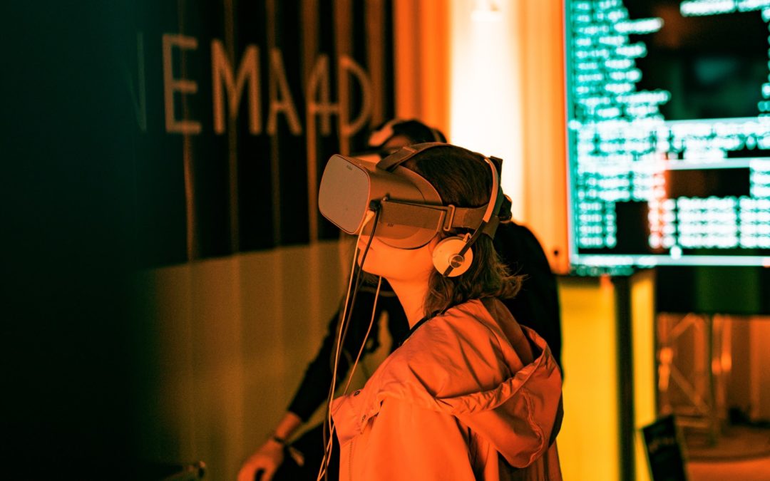 A person wearing VR goggles interacts with the Metaverse.